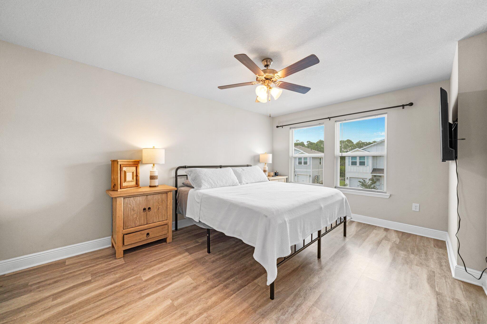 64 Crossing Lane, Unit E Santa Rosa Beach, FL 32459 - Photo 9 of 22 a bedroom with a bed and a window