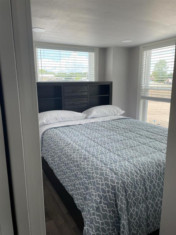 5226 Waterfront Road Kerens, TX 75144 - Photo 4 of 7 a room with a bed and a dresser