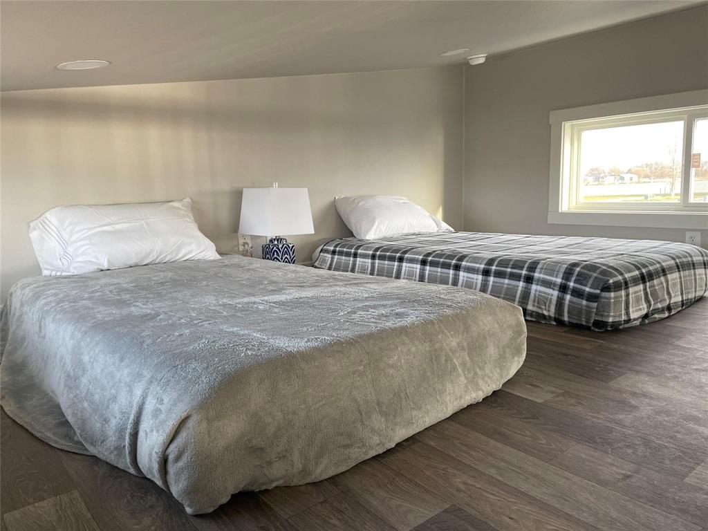 5226 Waterfront Road Kerens, TX 75144 - Photo 6 of 7 a bedroom with a bed and window