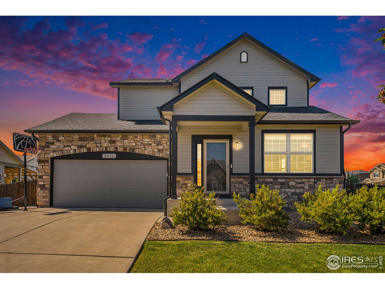 8421 Raspberry Drive Frederick, CO 80504 - Photo 1 of 24 a front view of a house with a yard