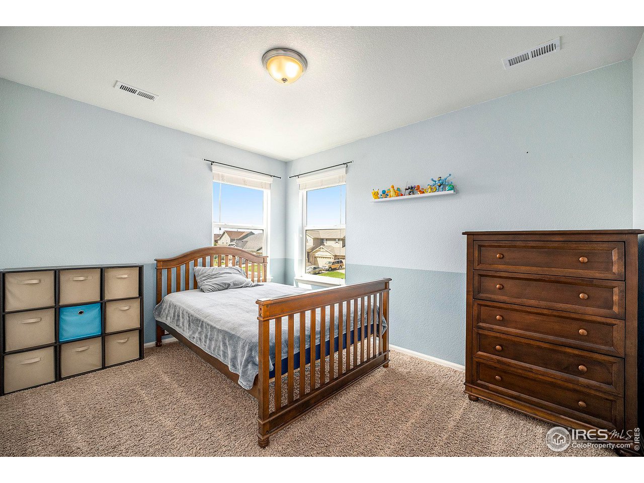 8421 Raspberry Drive Frederick, CO 80504 - Photo 15 of 24 a bedroom with a bed and a window