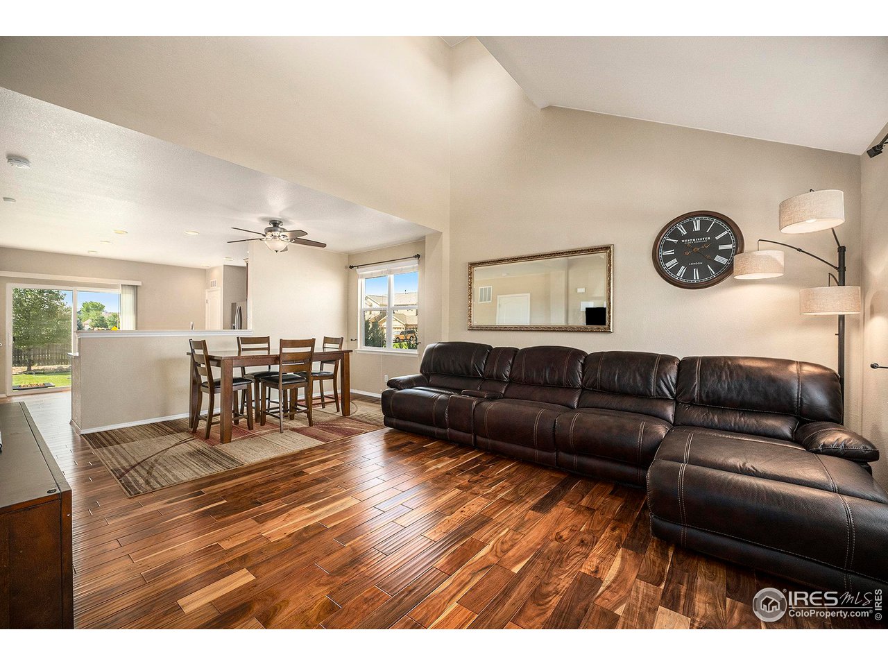 8421 Raspberry Drive Frederick, CO 80504 - Photo 4 of 24 a living room with furniture and a wooden floor