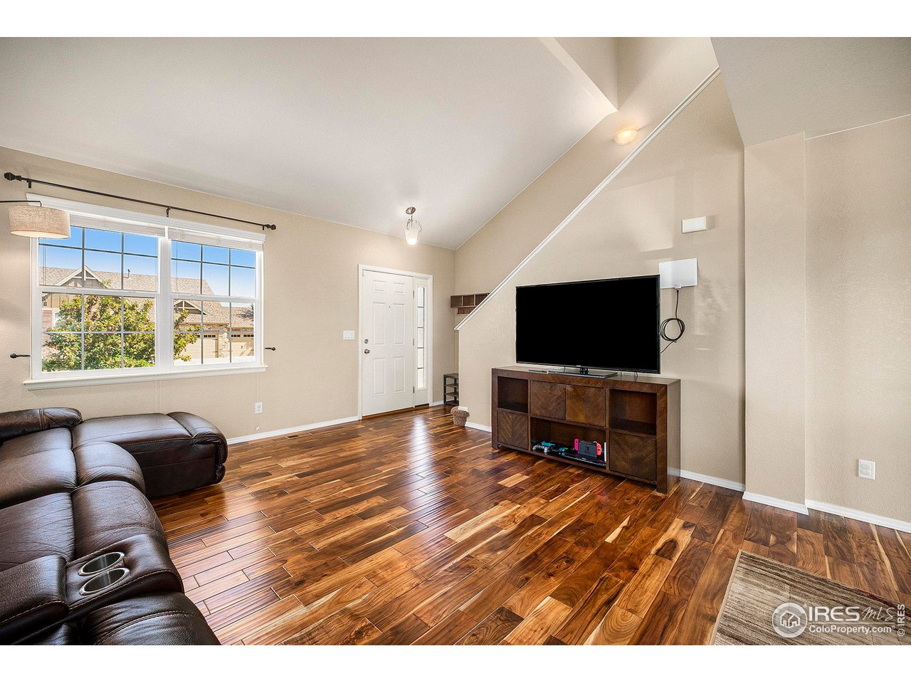 8421 Raspberry Drive Frederick, CO 80504 - Photo 5 of 24 a living room with furniture and a flat screen tv