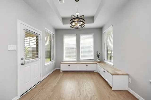 a bathroom with a tub sink and vanity