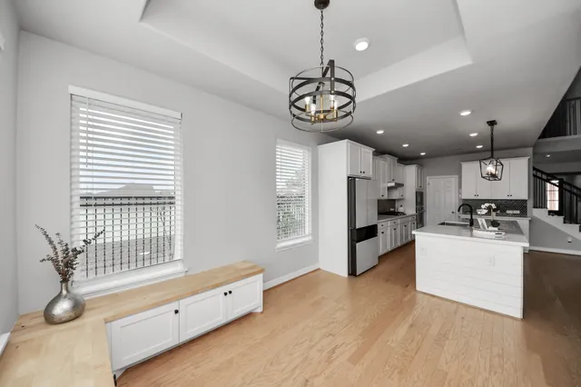 a view of a livingroom with wooden floor