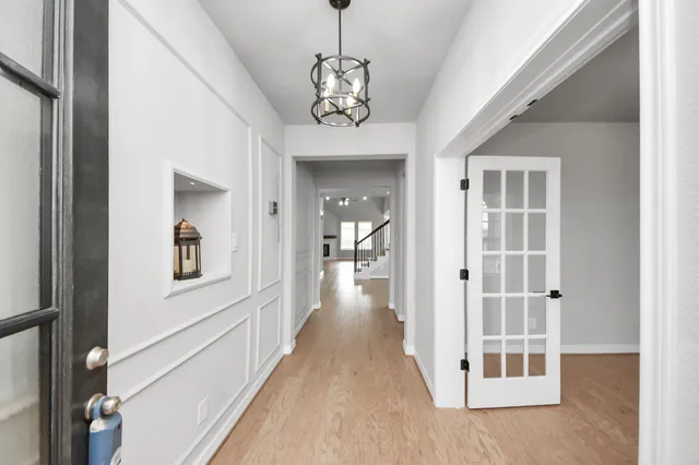 a large kitchen with granite countertop a large counter top appliances and cabinets