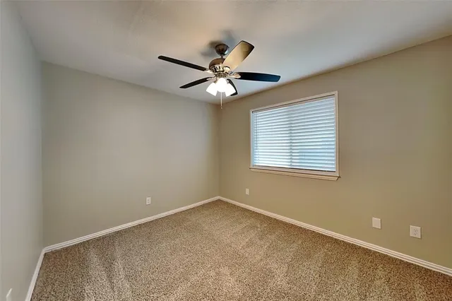 a bathroom with a granite countertop sink and a bathtub