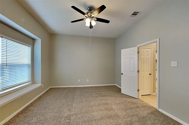 a view of a livingroom with a ceiling fan