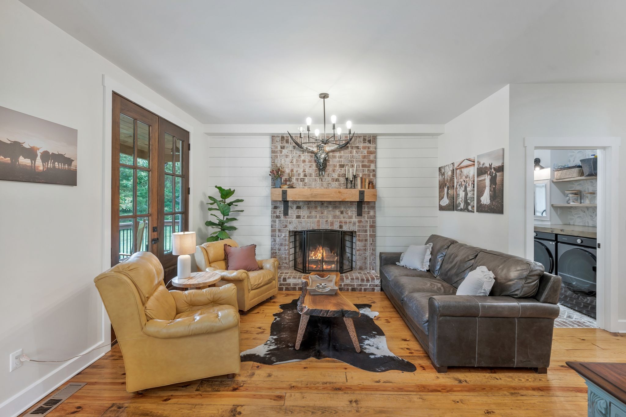 1006 Cherokee Trail Springfield, TN 37172 - Photo 18 of 49 a living room with furniture and a chandelier