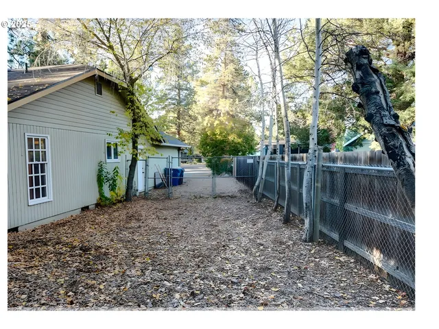 a backyard of a house with lots of green space