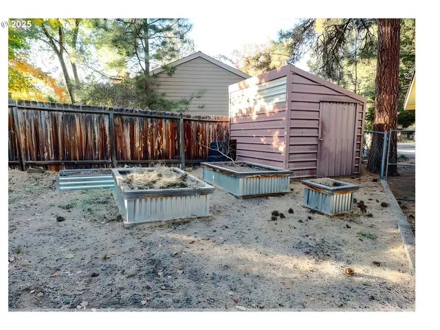 a backyard of a house with yard and outdoor seating