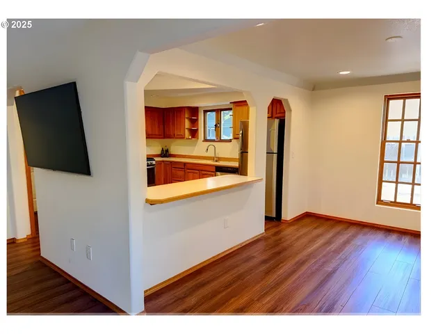 a view interior of a house and an entryway with wooden floor