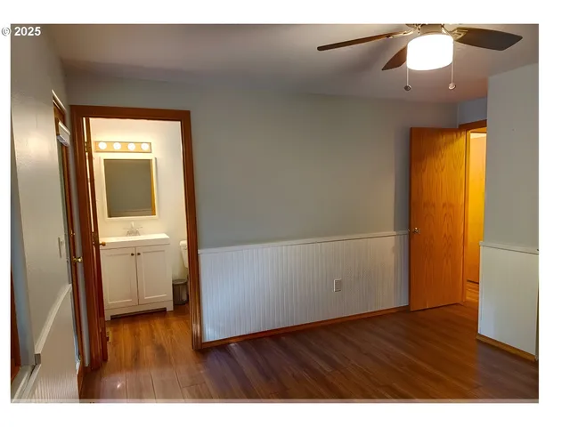 a view of an entryway with wooden floor