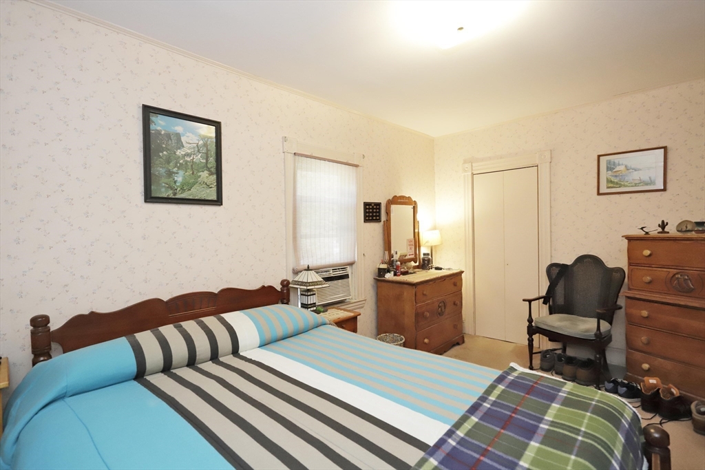 5 Anthony Street Acushnet, MA 02743 - Photo 26 of 37 a bedroom with a bed and furniture