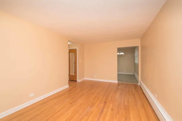 a view of hallway with wooden floor