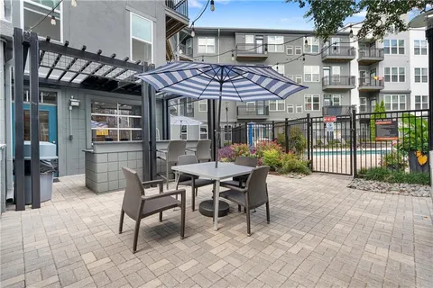 a dinning table and chairs in patio of the house