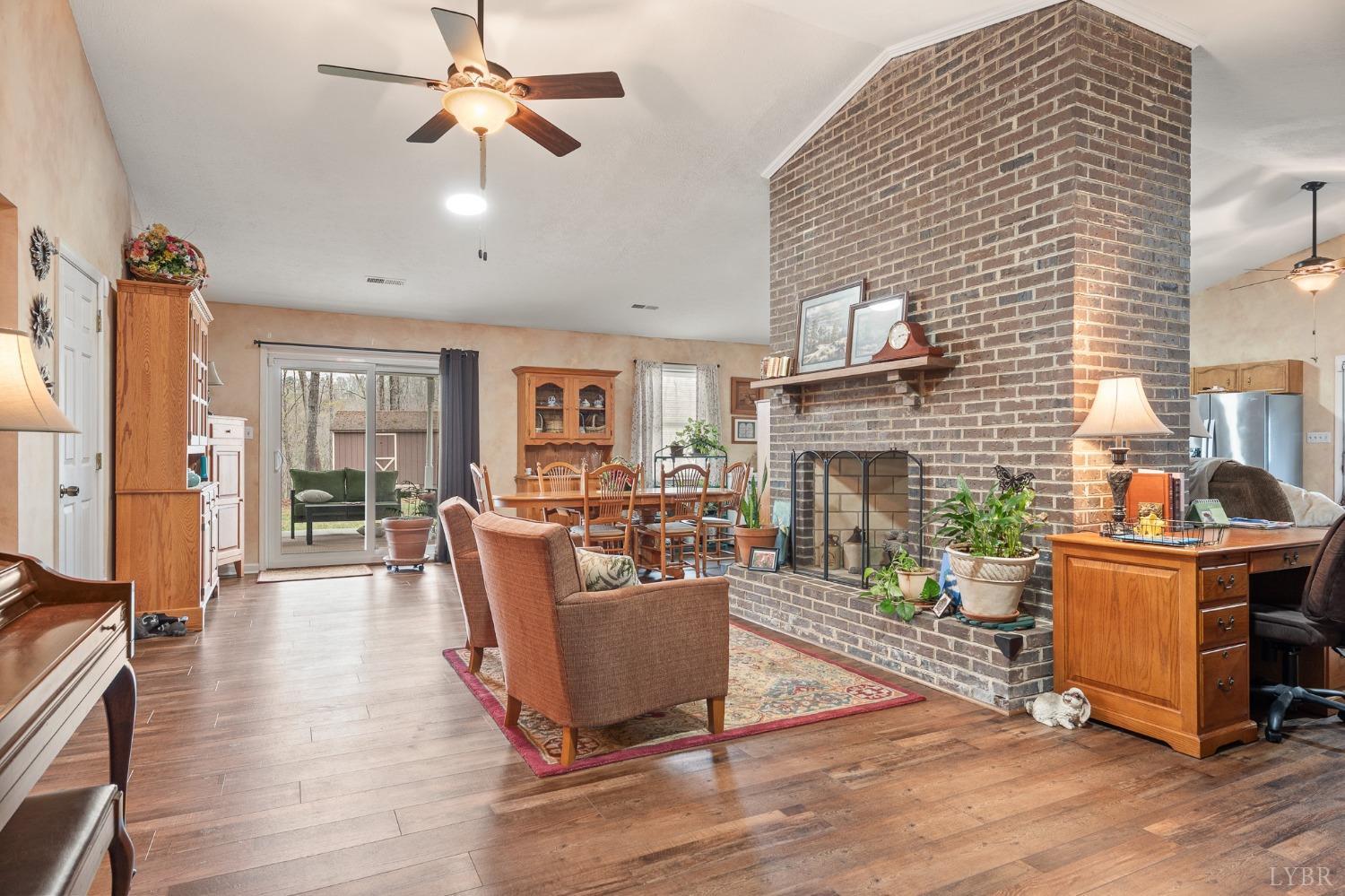 1425 Kentmoor Farm Road Madison Heights, VA 24572 - Photo 11 of 47 a living room with fireplace furniture and a wooden floor