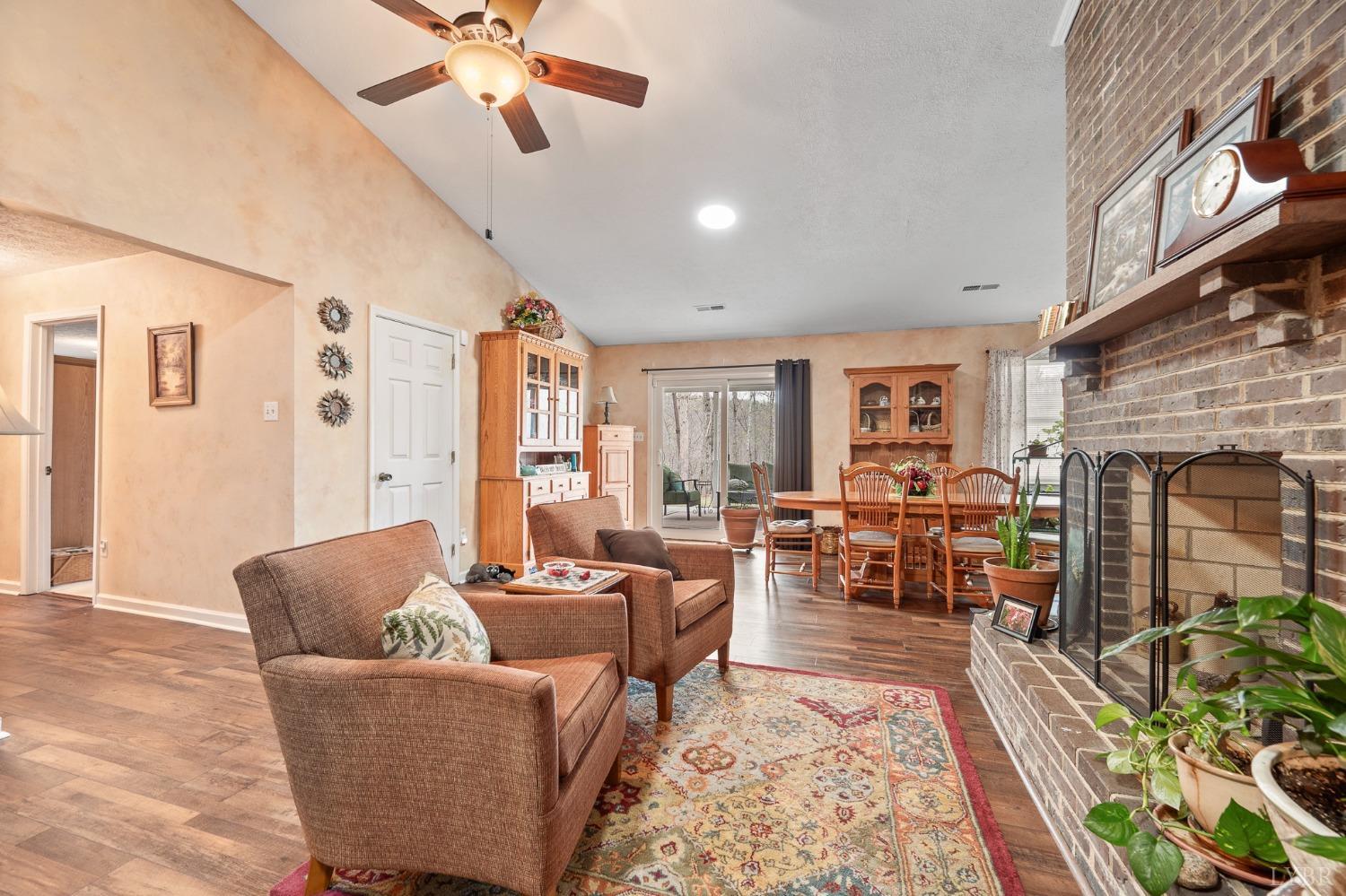 1425 Kentmoor Farm Road Madison Heights, VA 24572 - Photo 12 of 47 a living room with furniture fireplace and a window