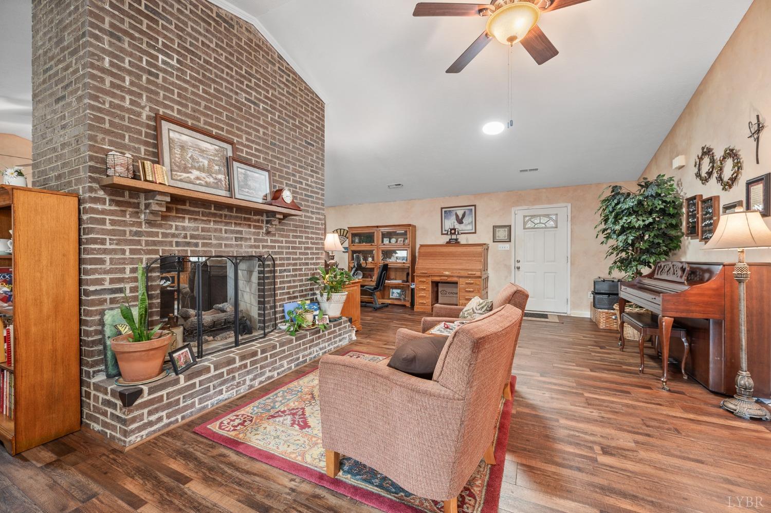 1425 Kentmoor Farm Road Madison Heights, VA 24572 - Photo 13 of 47 a living room with furniture and a fireplace