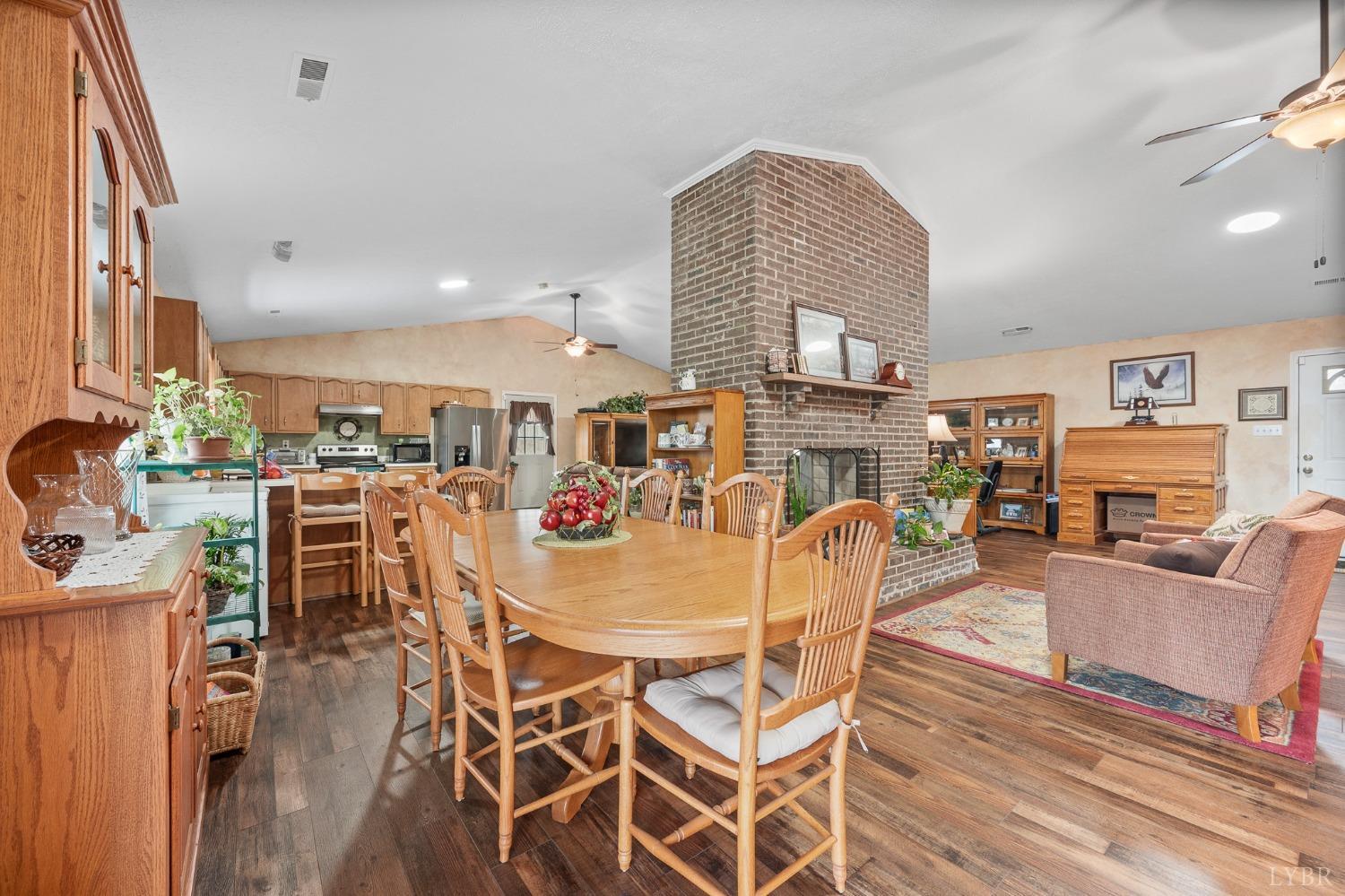 1425 Kentmoor Farm Road Madison Heights, VA 24572 - Photo 16 of 47 a dining room with furniture and wooden floor