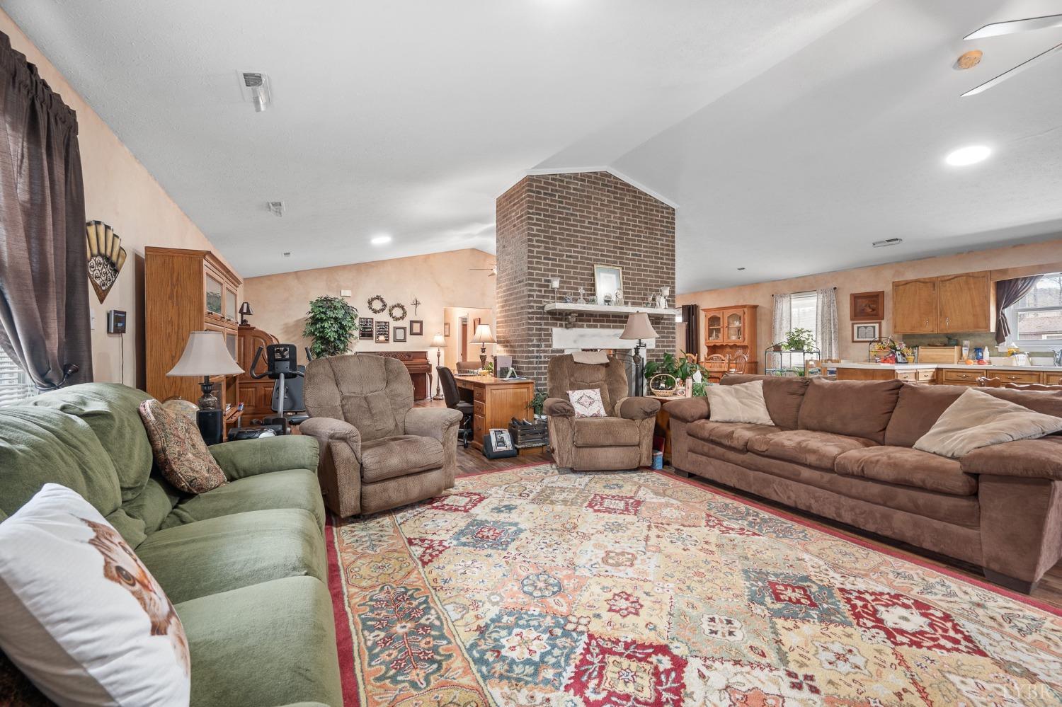 1425 Kentmoor Farm Road Madison Heights, VA 24572 - Photo 24 of 47 a living room with furniture and a fireplace