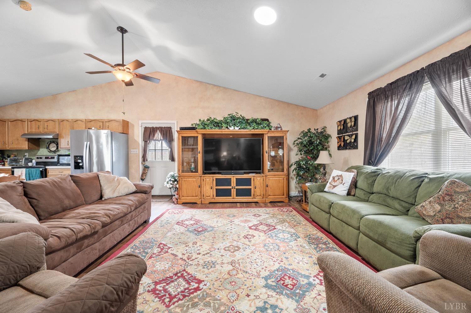 1425 Kentmoor Farm Road Madison Heights, VA 24572 - Photo 25 of 47 a living room with furniture a flat screen tv and a window