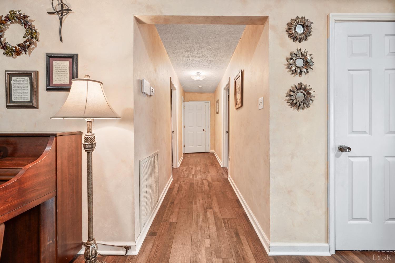 1425 Kentmoor Farm Road Madison Heights, VA 24572 - Photo 27 of 47 a view of a hallway with wooden floor and staircase