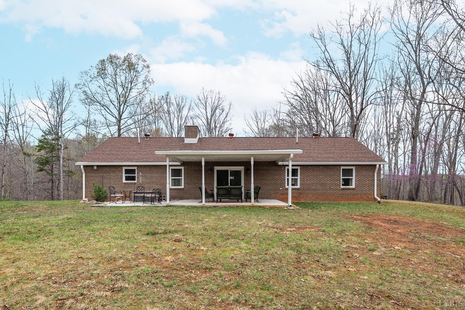 1425 Kentmoor Farm Road Madison Heights, VA 24572 - Photo 34 of 47 a house that has a tree in front of it