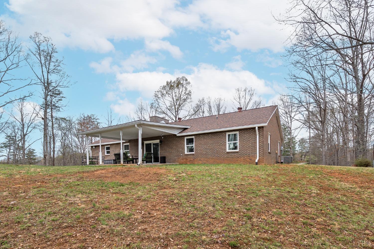 1425 Kentmoor Farm Road Madison Heights, VA 24572 - Photo 35 of 47 a front view of house with yard and trees around