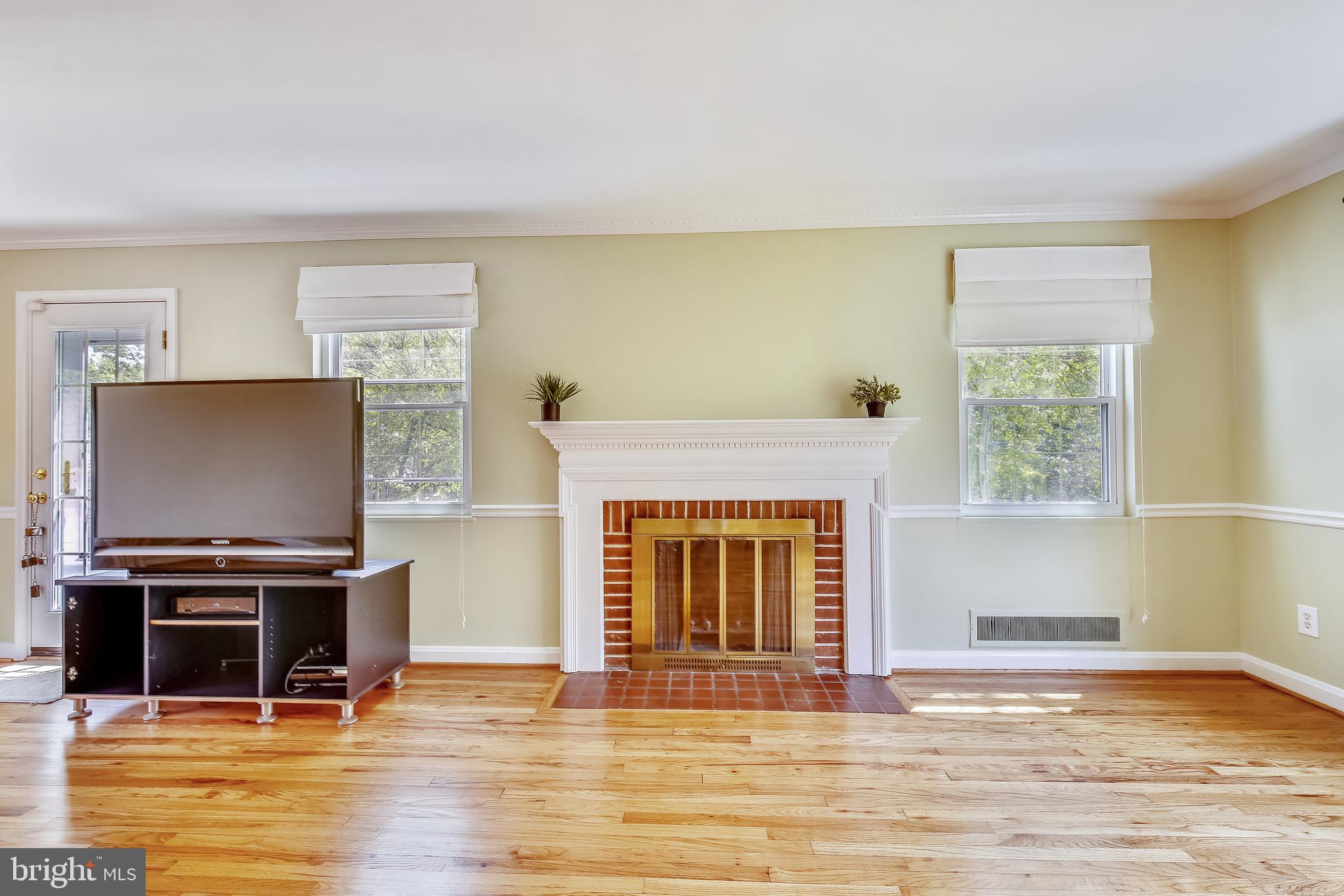 2501 Plyers Mill Road Silver Spring, MD 20902 - Photo 18 of 68 Living room with wood buring fireplace