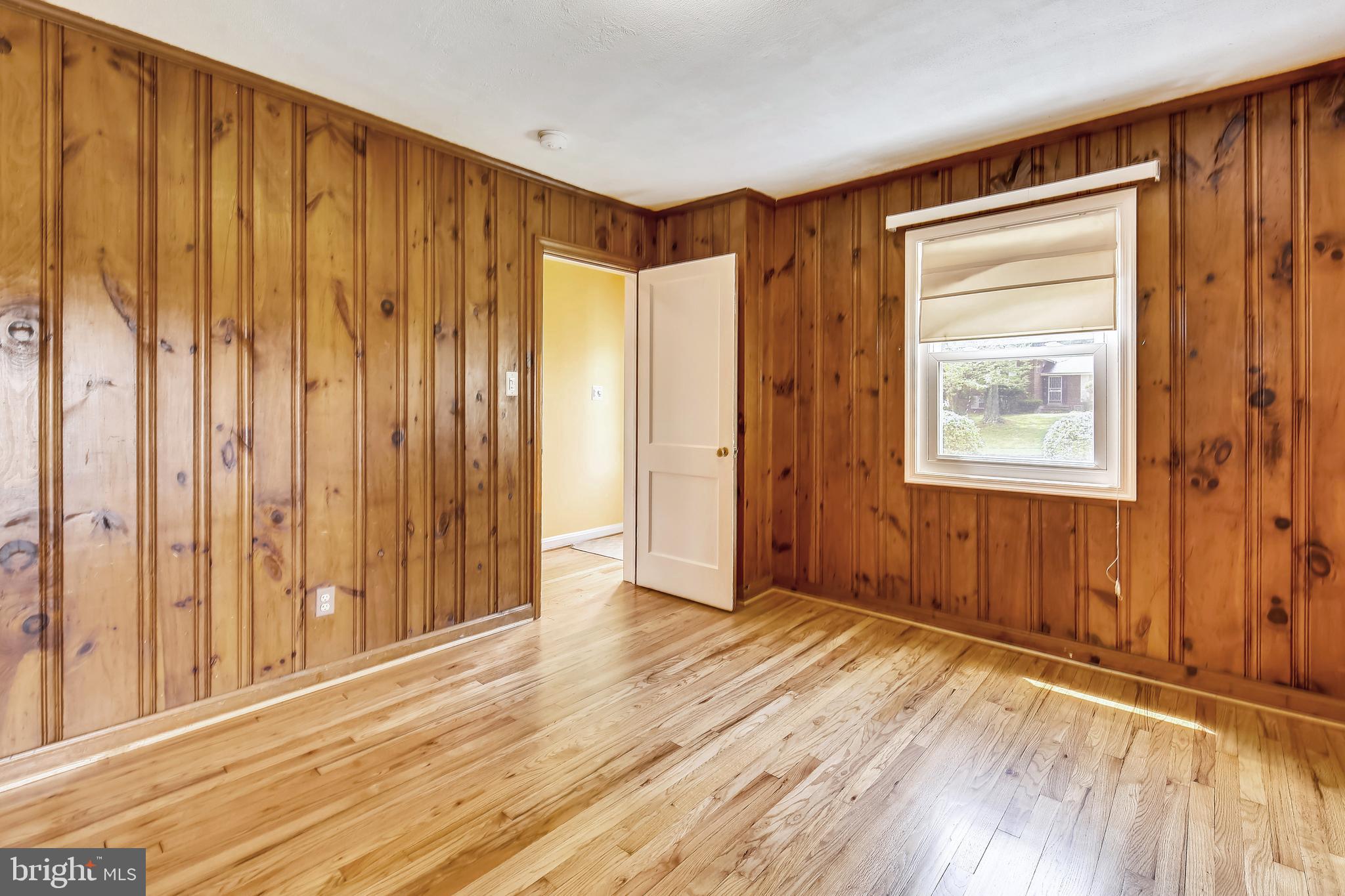 2501 Plyers Mill Road Silver Spring, MD 20902 - Photo 26 of 68 main level bedroom with knotty pine