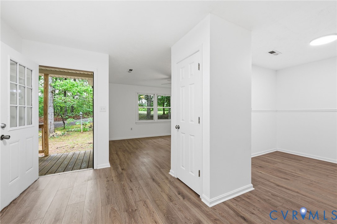 3220 Greenway Road Gladstone, VA 24553 - Photo 6 of 29 an empty room with wooden floor and windows