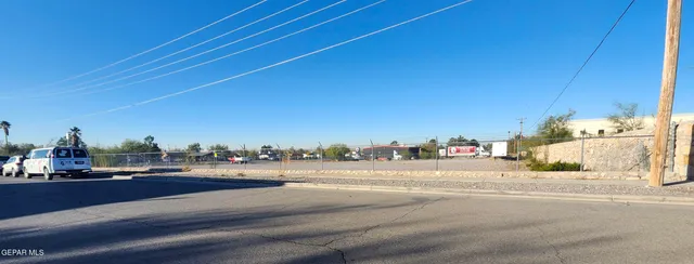 a view of a road with a building in the background