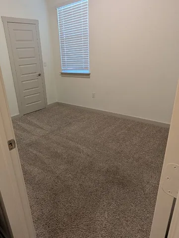 a bathroom with a shower and a sink