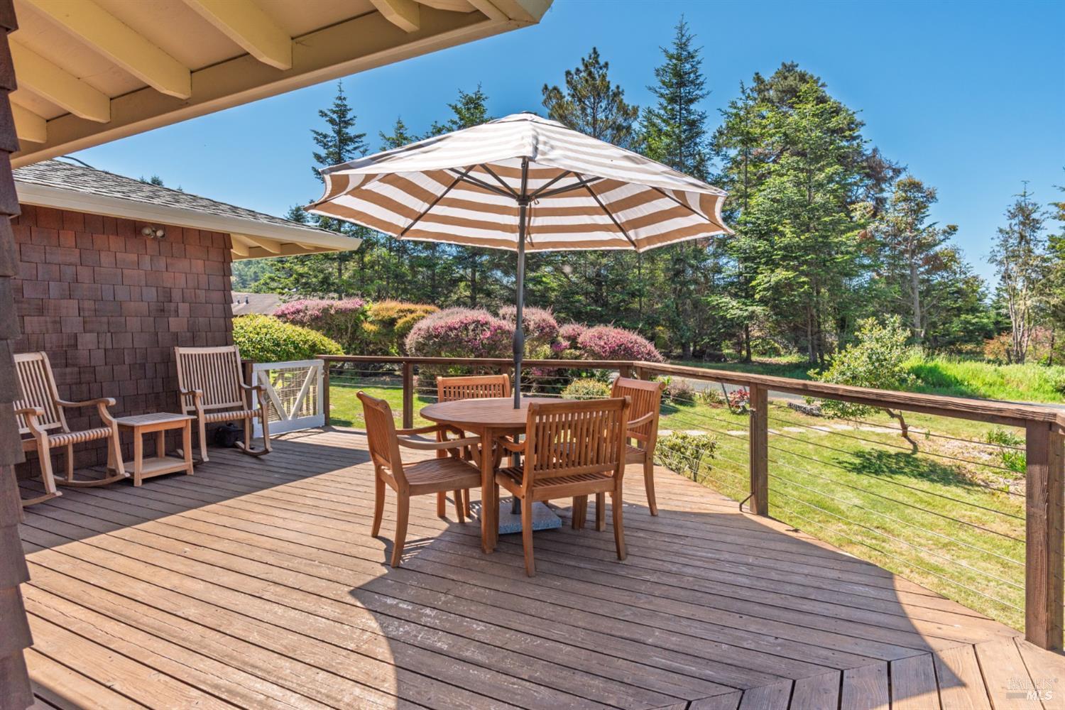 15721 Forest View Road Manchester, CA 95459 - Photo 10 of 50 Approx. 700 +/- sq. ft. of wrap-around decking enhance the beauty and livability of this home..