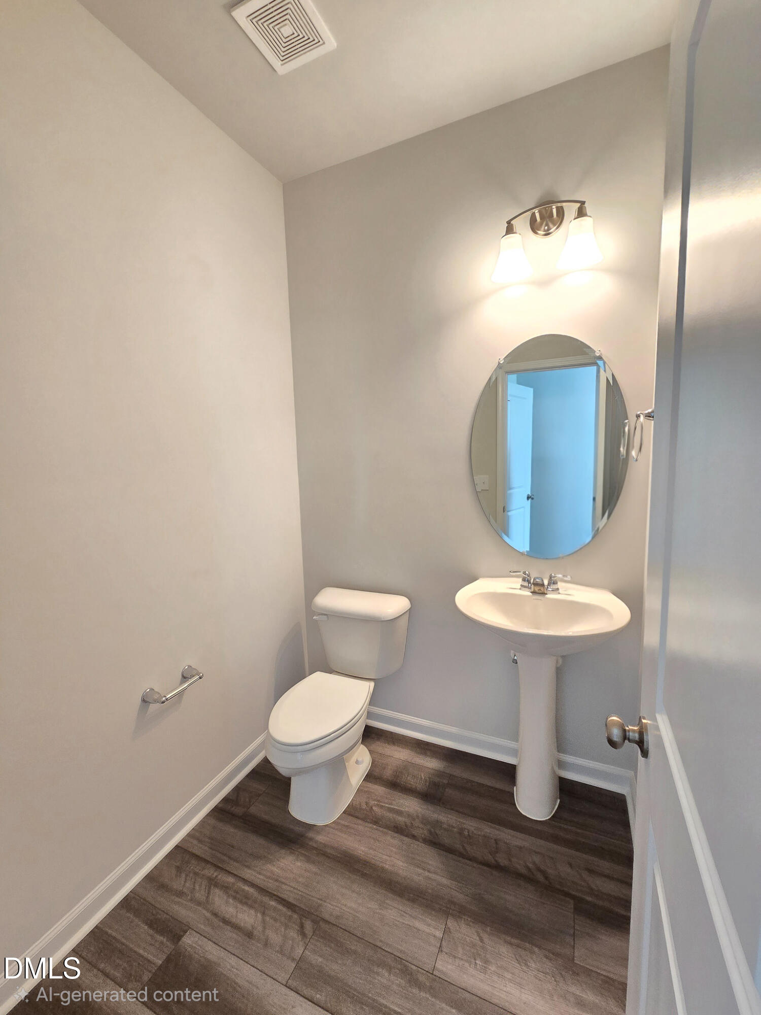2431 Kasota Lane Raleigh, NC 27610 - Photo 25 of 46 a bathroom with a toilet sink and mirror