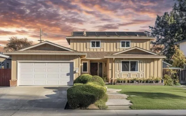 front view of a house with a yard