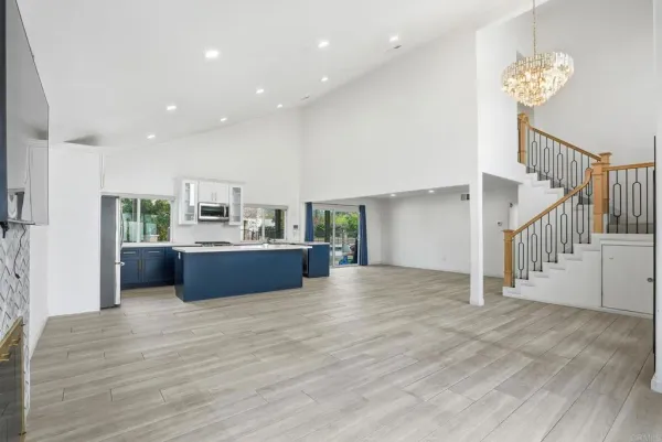 a view of kitchen and kitchen with furniture wooden floor and a view