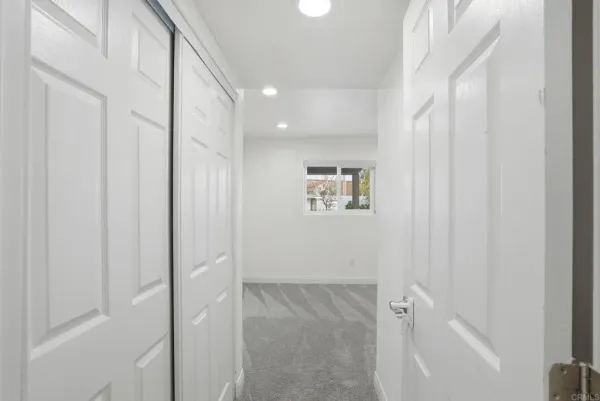 a view of a hallway with closet area