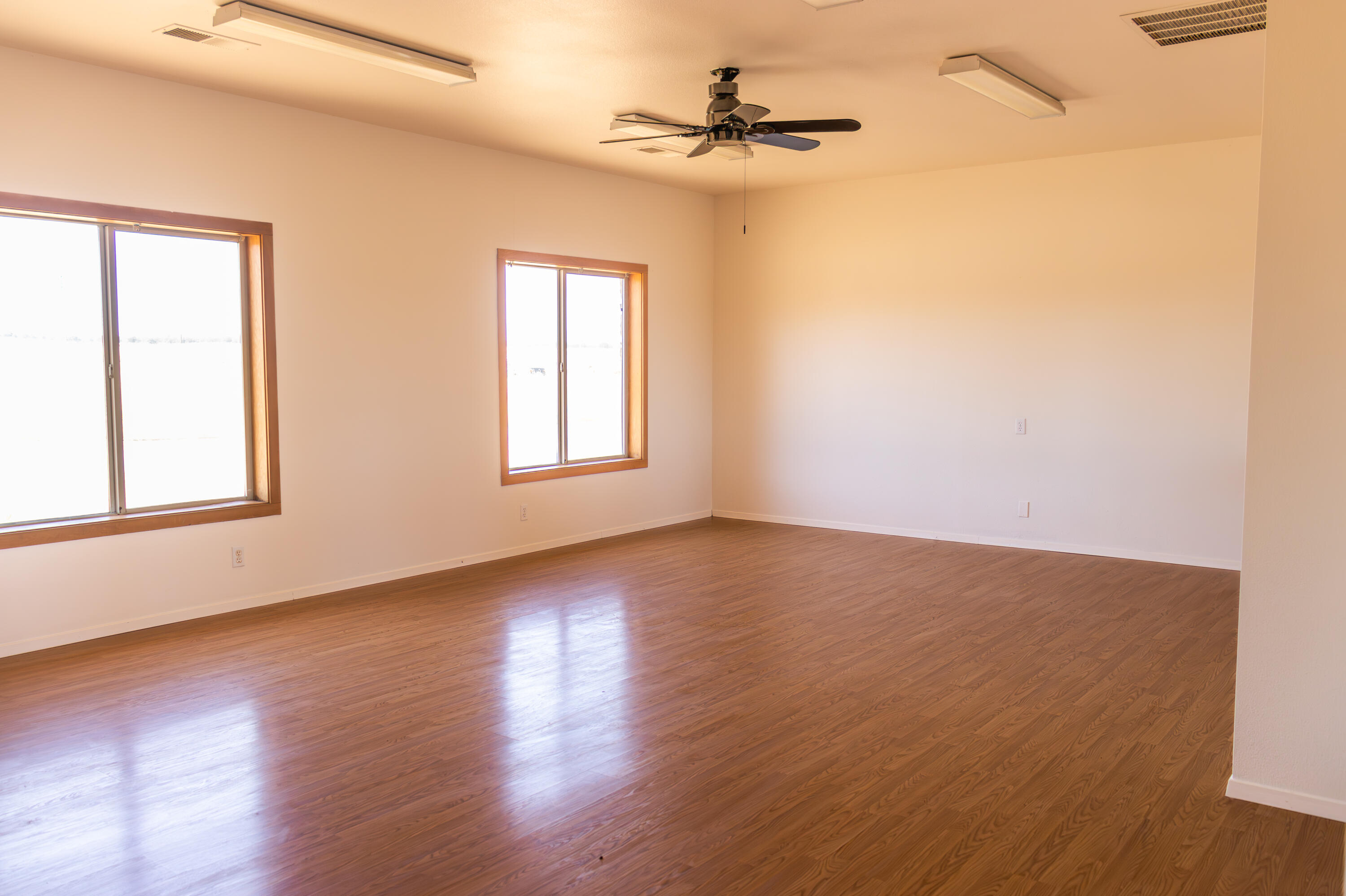 17945 Rivers Edge Drive Red Bluff, CA 96080 - Photo 19 of 25 a view of an empty room with wooden floor and a window