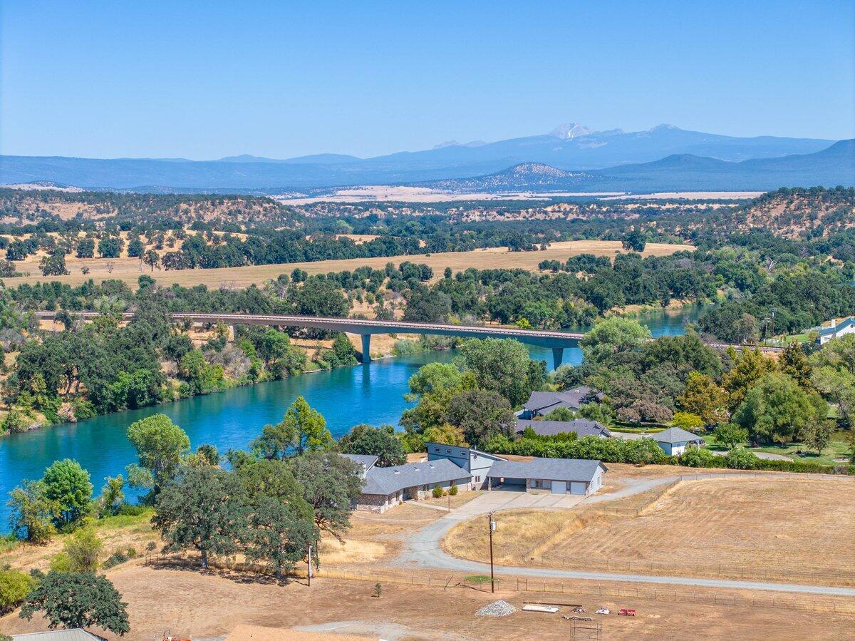 17945 Rivers Edge Drive Red Bluff, CA 96080 - Photo 2 of 25 an aerial view of a city with mountains