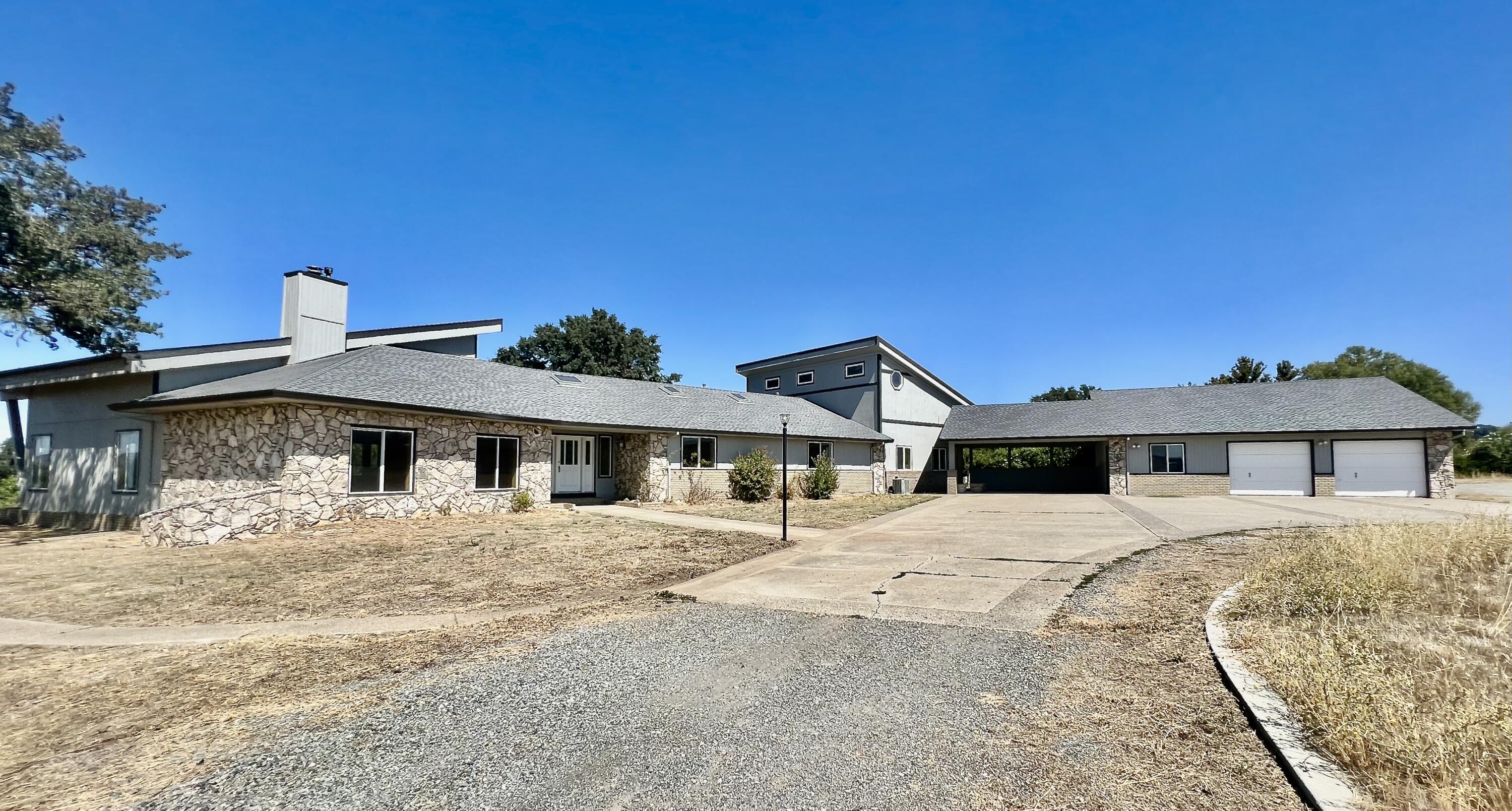 17945 Rivers Edge Drive Red Bluff, CA 96080 - Photo 5 of 25 a large white building with a view of a house