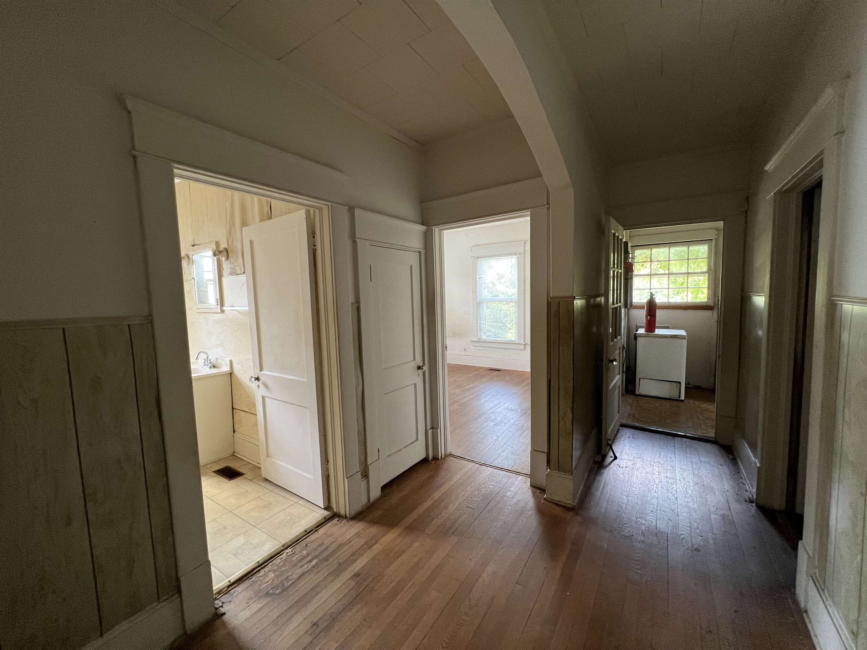 1309 Lancaster Street Durham, NC 27705 - Photo 8 of 30 a view of a hallway with wooden floor and a living room