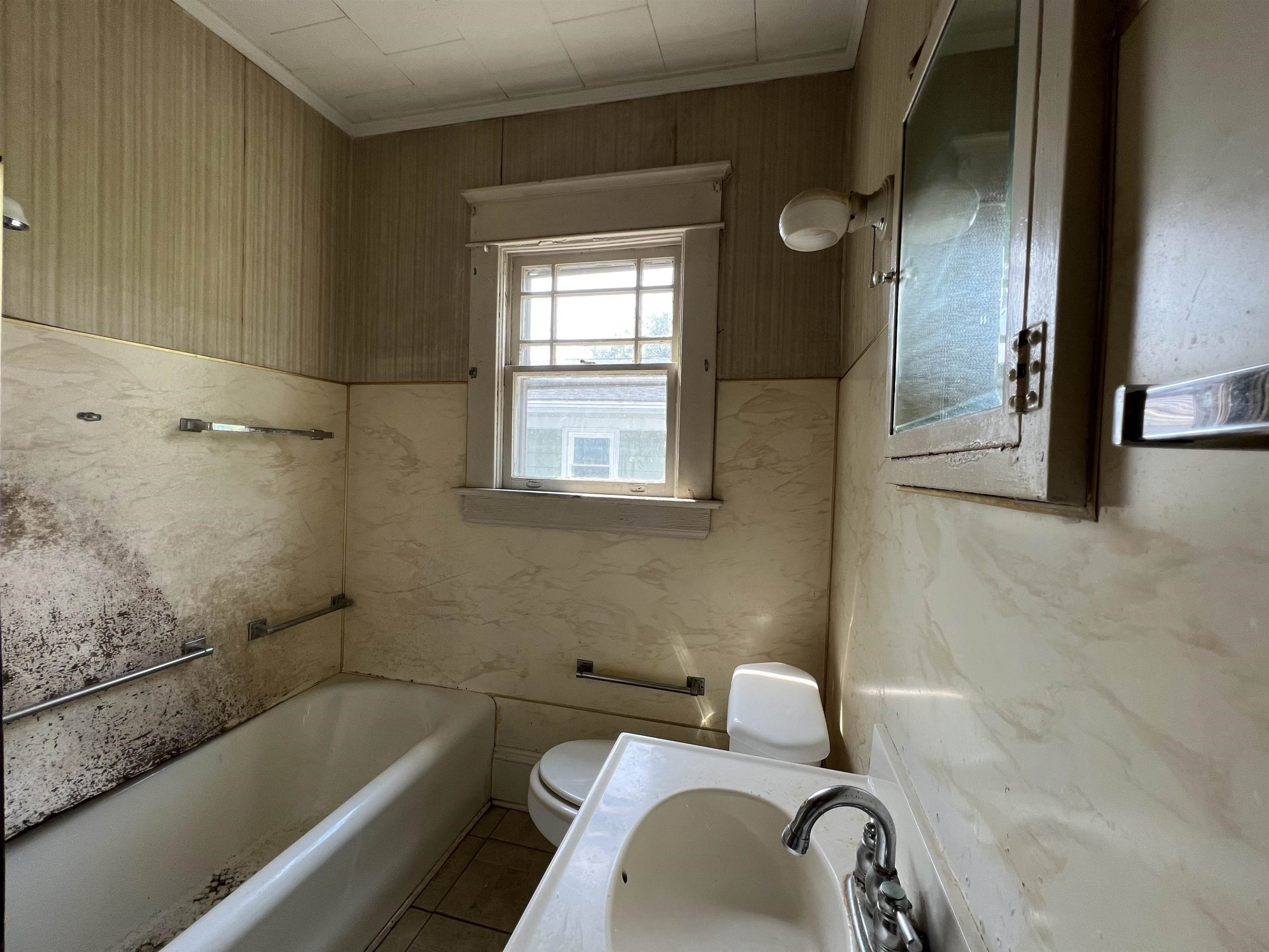 1309 Lancaster Street Durham, NC 27705 - Photo 9 of 30 a bathroom with a granite countertop sink and a bathtub