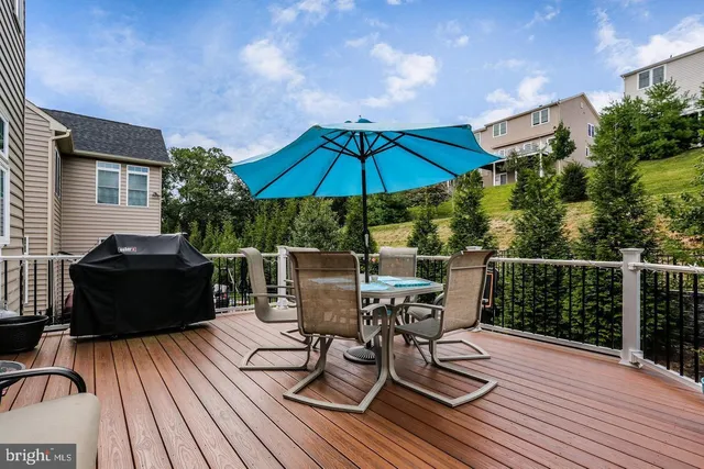 a view of balcony with outdoor seating and wooden floor