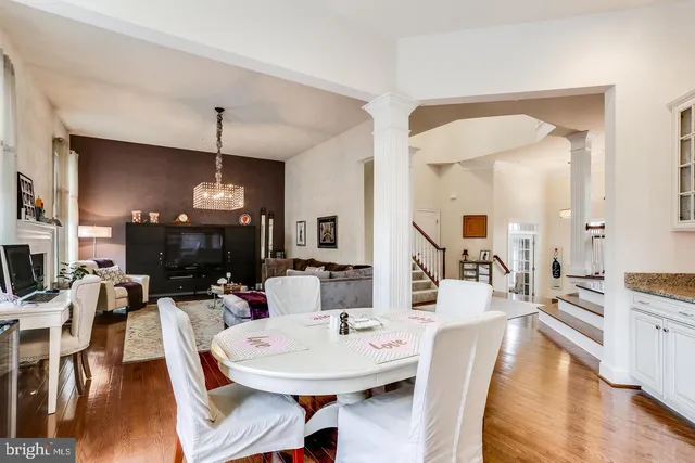 a living room with fireplace furniture and a wooden floor