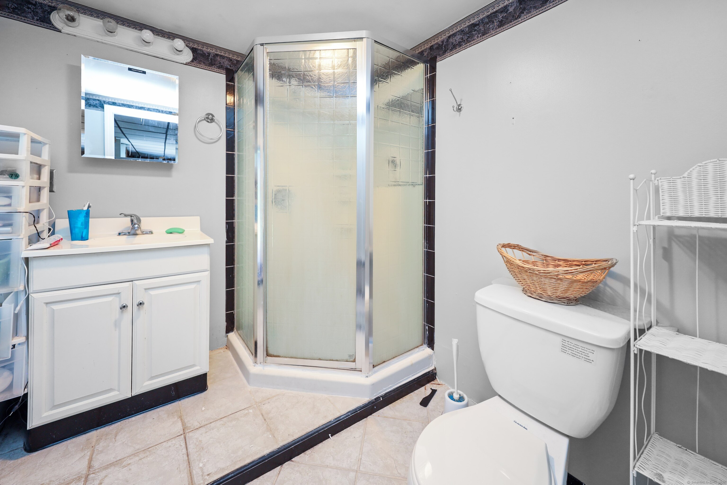 3 Rozum Circle Prospect, CT 06712 - Photo 22 of 40 a bathroom with a granite countertop toilet sink and shower