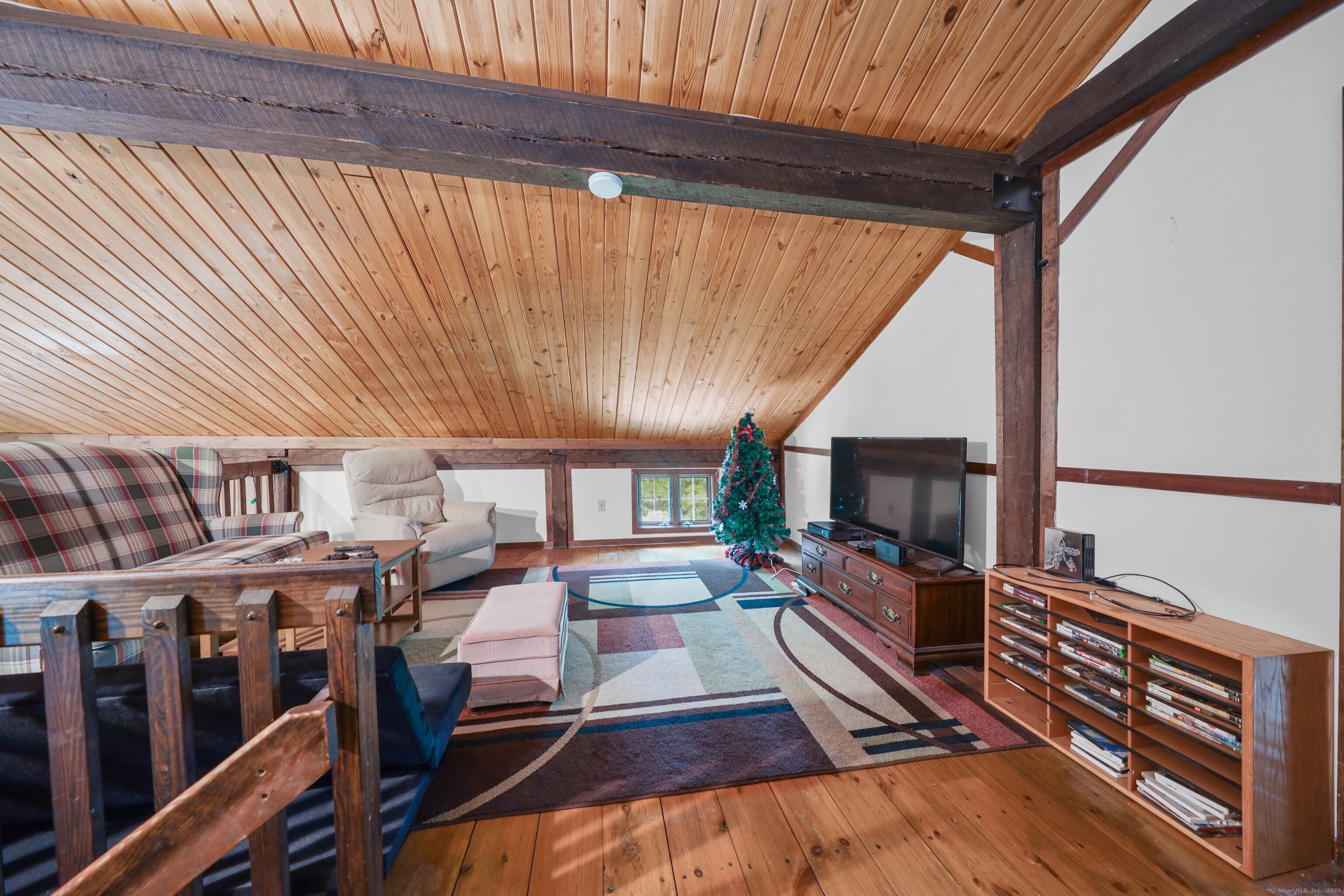 3 Rozum Circle Prospect, CT 06712 - Photo 25 of 40 a living room with lots of furniture and a flat screen tv