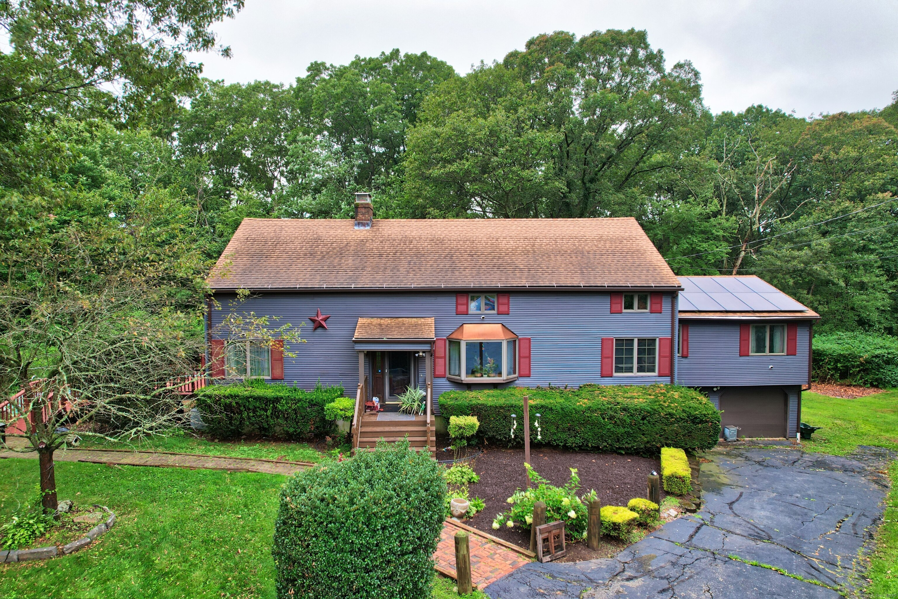 3 Rozum Circle Prospect, CT 06712 - Photo 39 of 40 a front view of a house with garden
