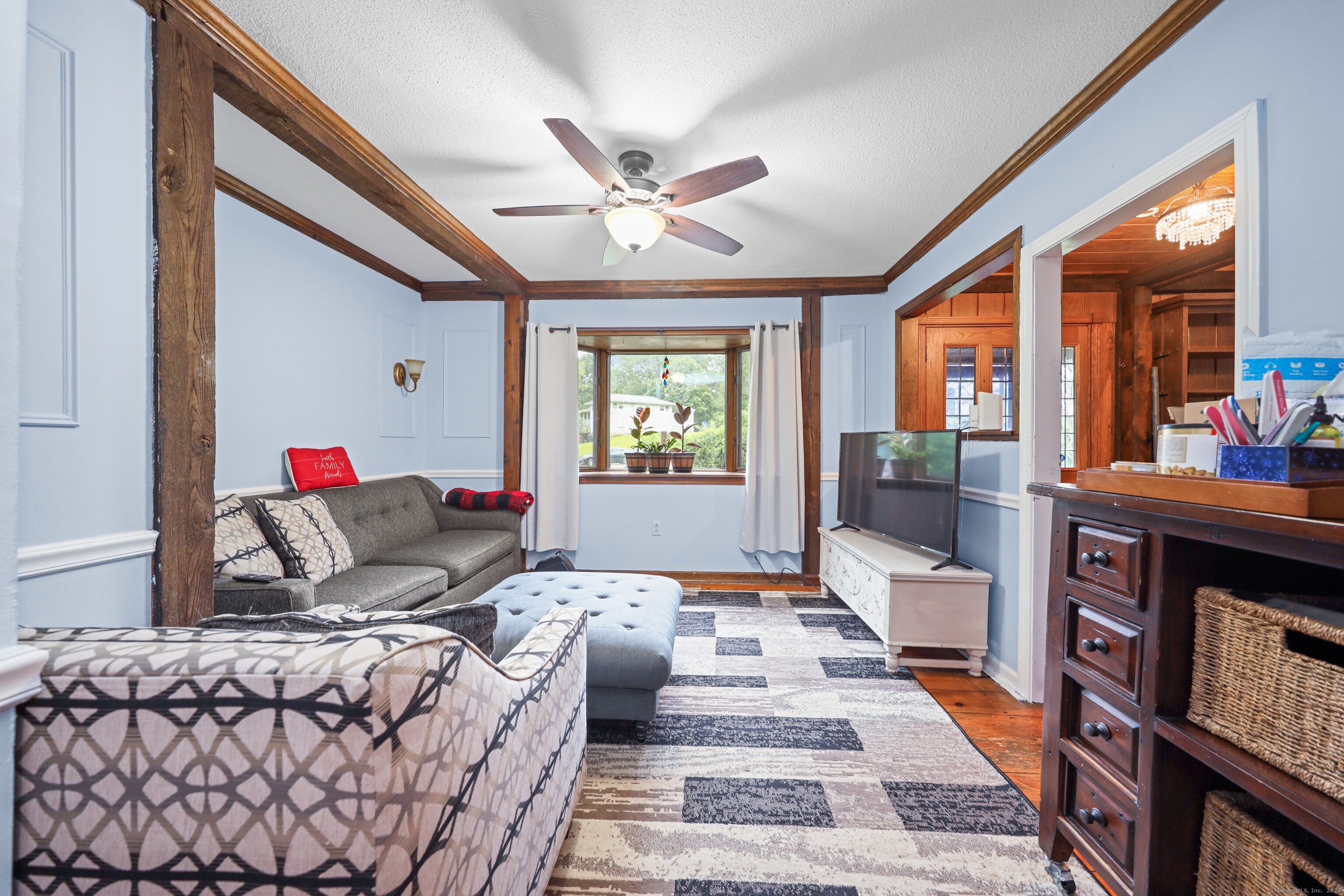 3 Rozum Circle Prospect, CT 06712 - Photo 10 of 40 a living room with furniture a rug and a large window